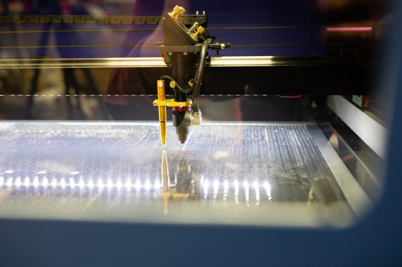 A 3-D printer in action. The platform in the printer is lit up.