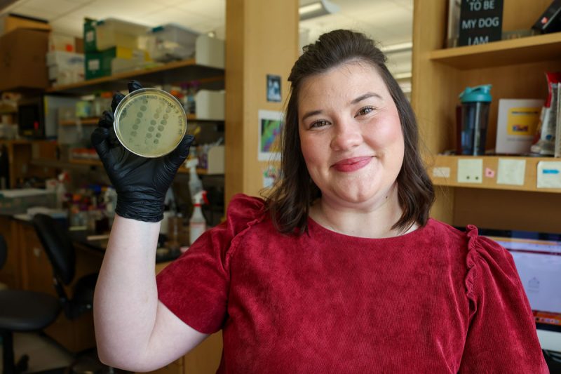 Hollyn Franklin holds up a petri dish